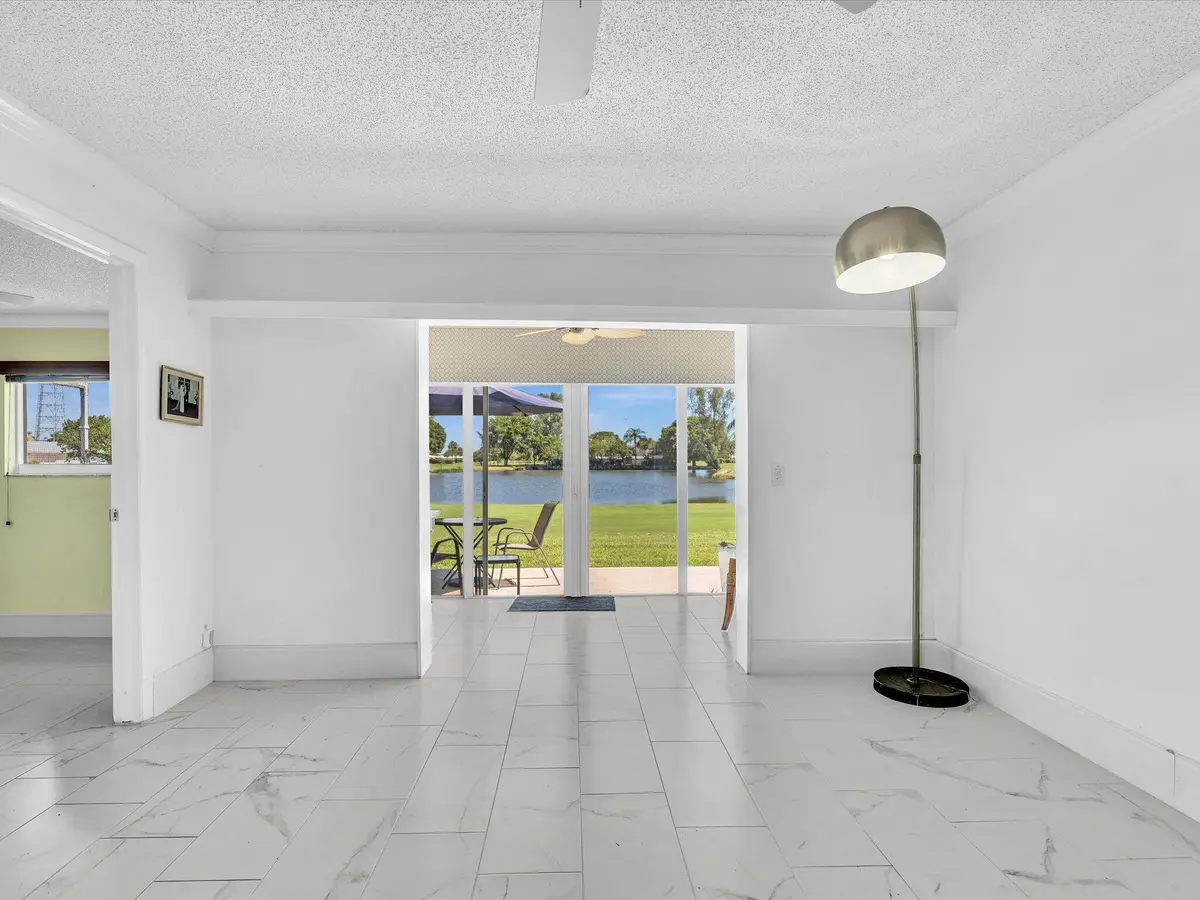 Living Room Plus Enclosed Patio at 2017 SW GOLF Lane 109, Boynton Beach