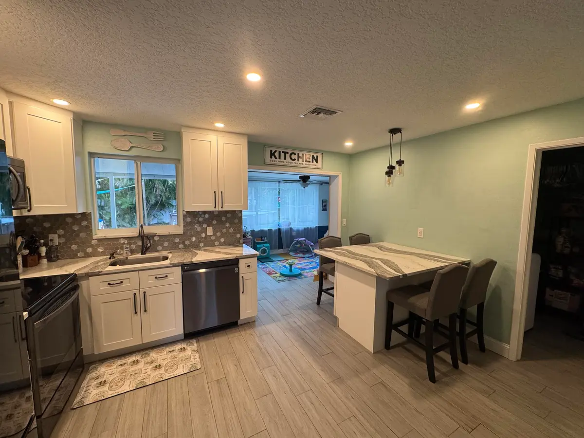 Kitchen/backroom at 60 NE 46th Street, Oakland Park