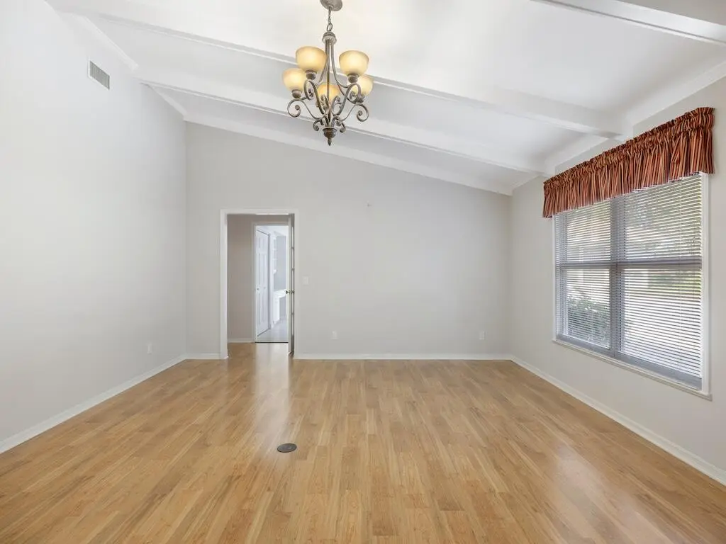 Living room with vaulted ceilings at 4790 16th Street, Vero Beach