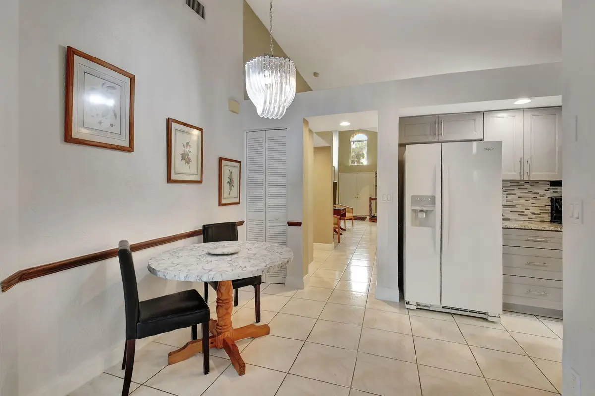 Eat In Kitchen into Dining, Living Room at 11161 Sangria Court, Boca Raton
