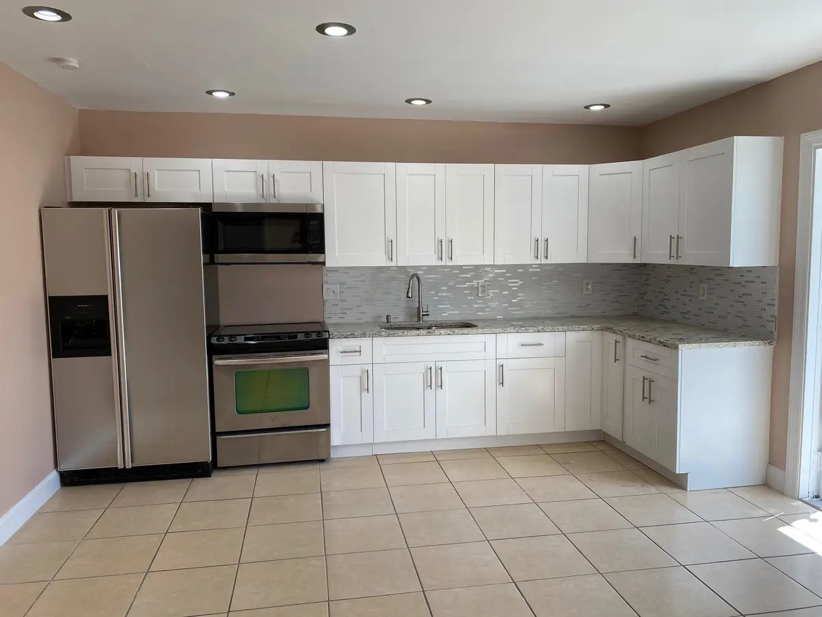 Kitchen with granite counters at 16 NE 9th Avenue, Deerfield Beach