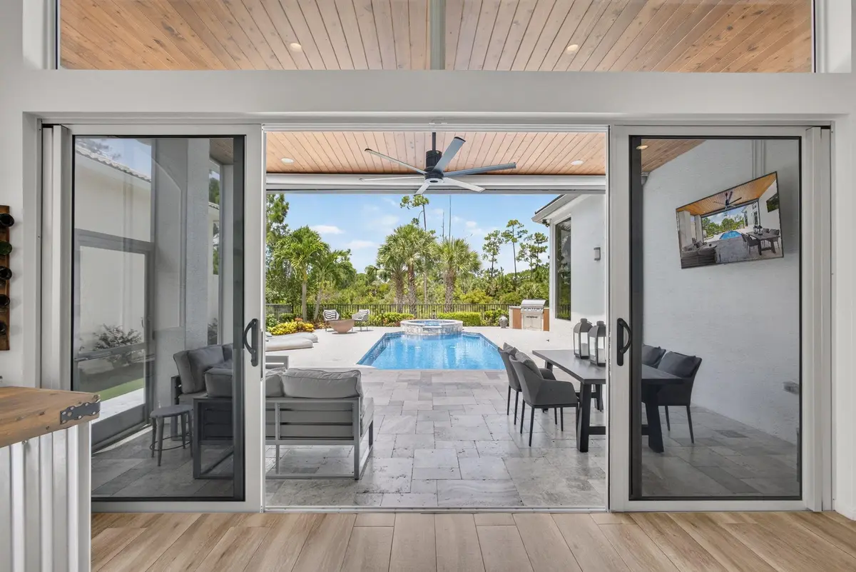 Great Room to outdoor living area at 142 Porto Vecchio Way, Palm Beach Gardens