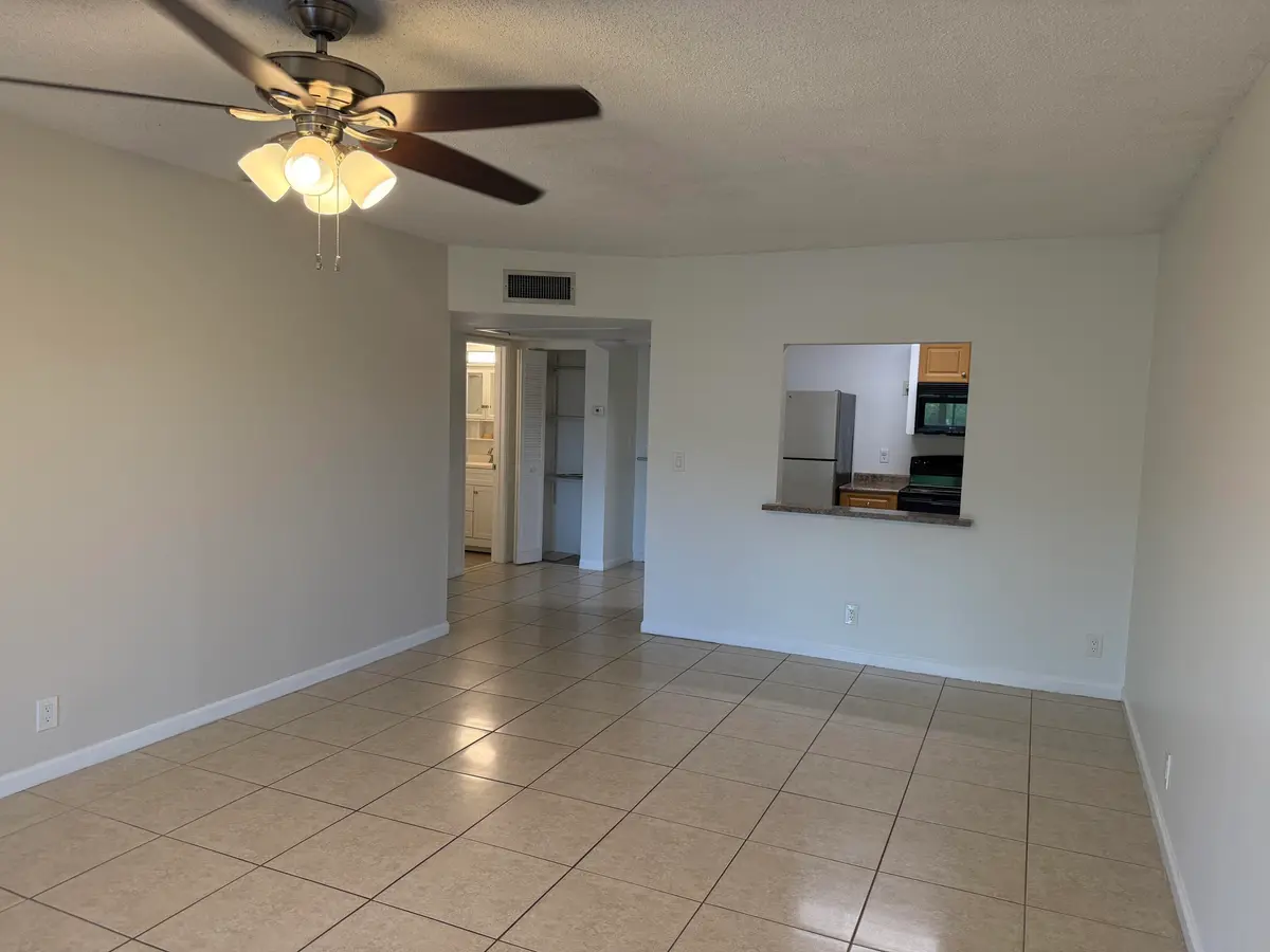 Living/dining room at 255 S Cypress Road 339, Pompano Beach