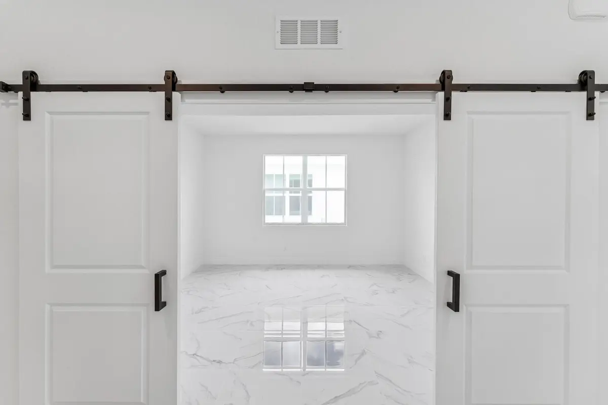 Home Office with Barn Doors at 10072 NW Field Flower Trail, Port St. Lucie