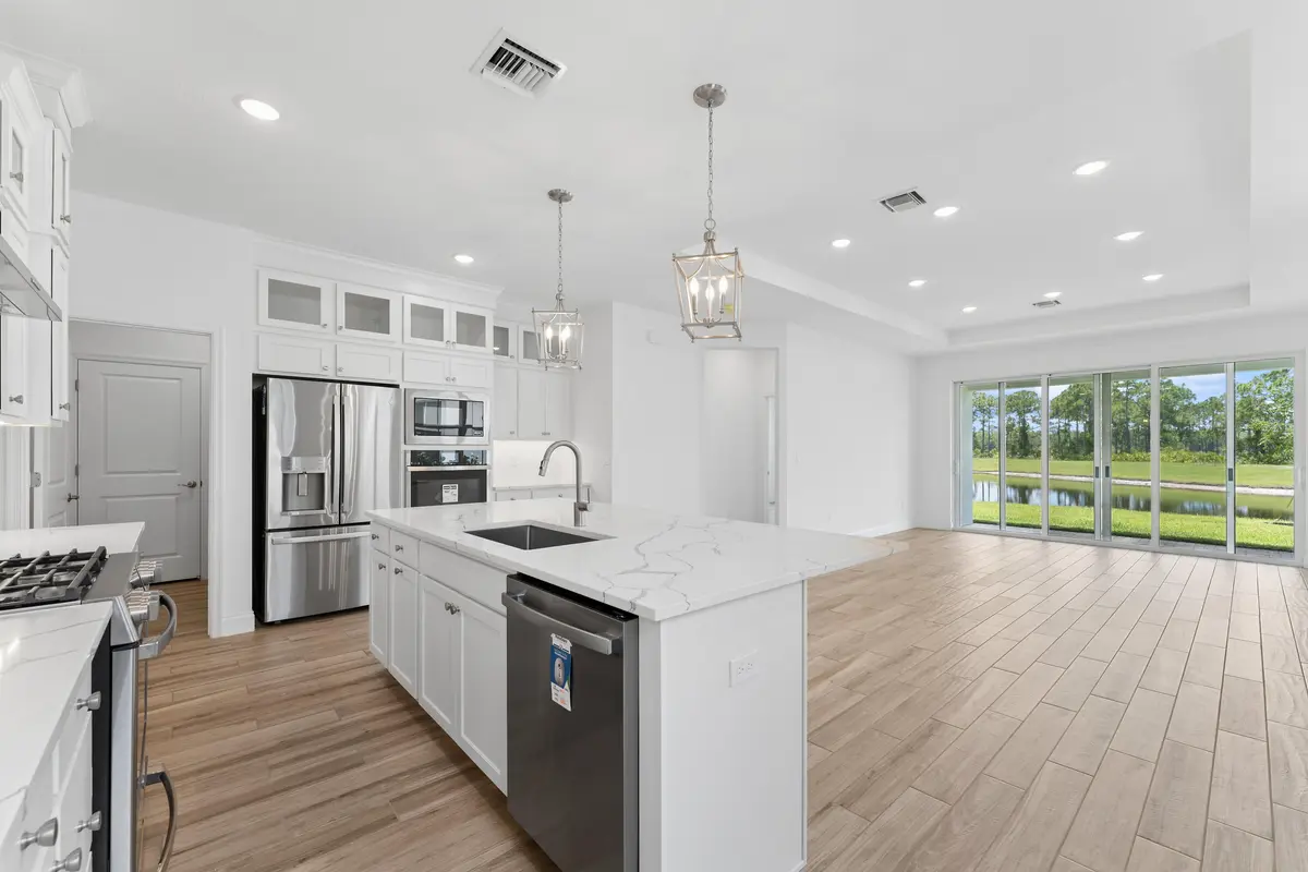 Kitchen, Great Room & Dining Area at 6172 NW Tuckaway Avenue, Port St. Lucie