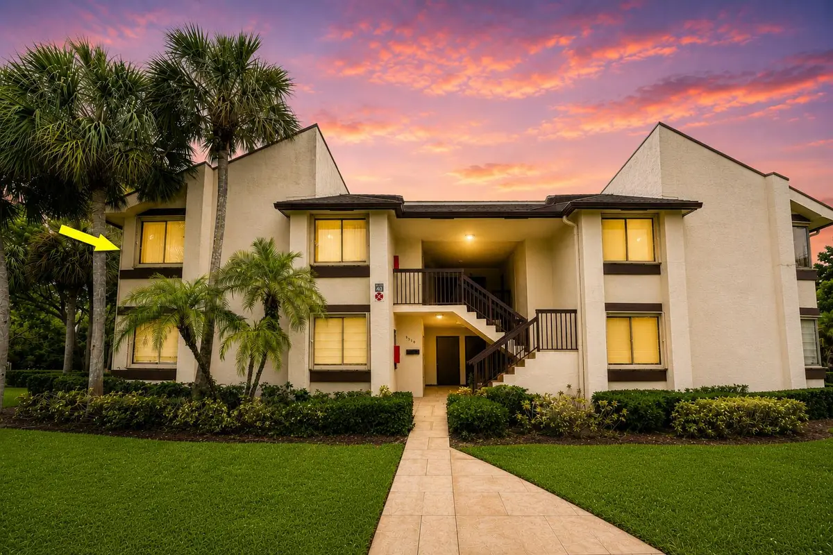 Front of building twilighted yellow arro at 9310 SW 23rd Street 4003, Davie