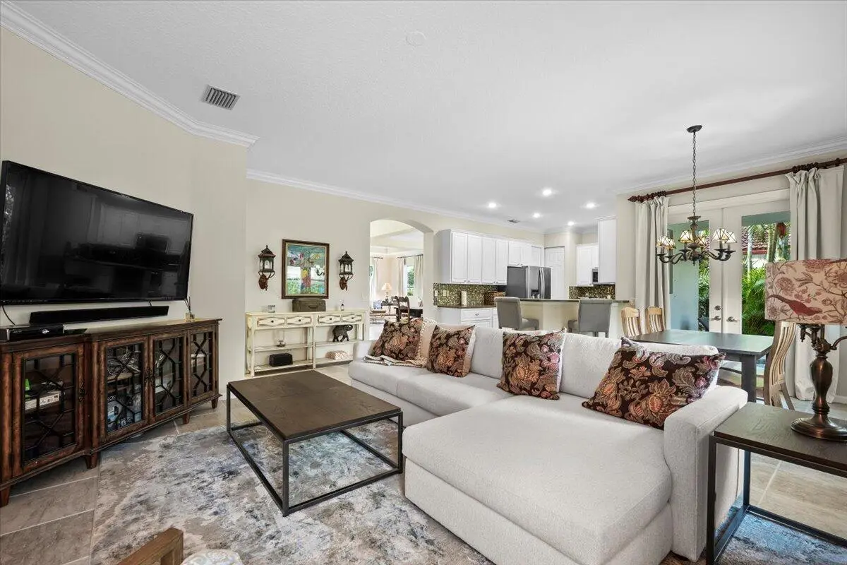 Living area facing kitchen at 464 Oriole Lane, Jupiter