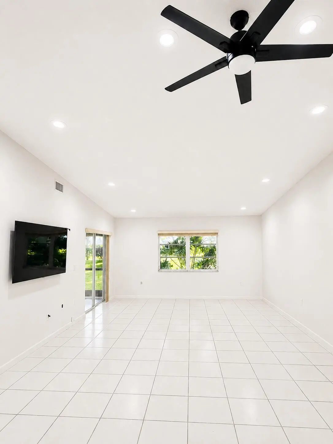 living room softer white walls at 6356 Pointe Pleasant Circle, Delray Beach