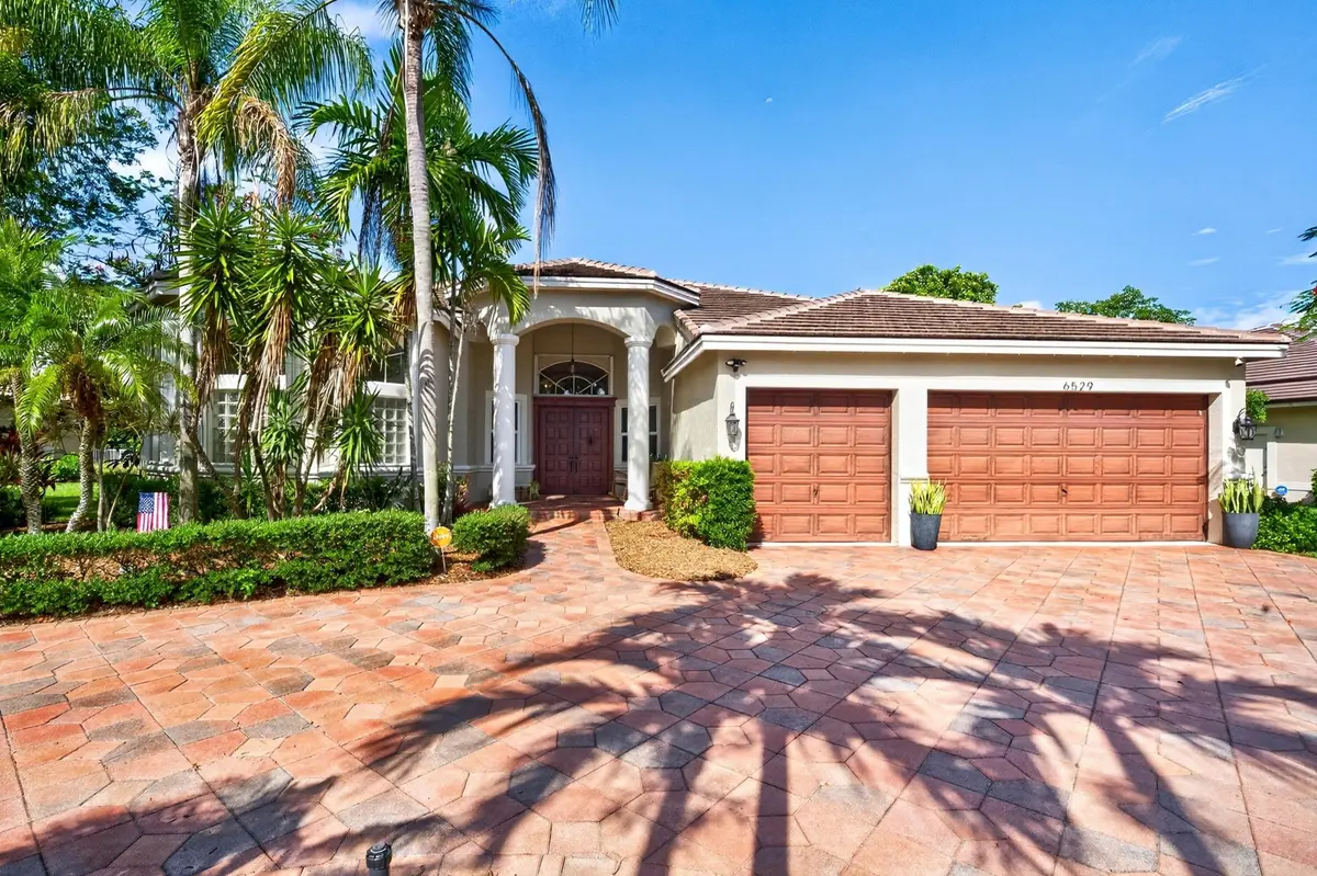 002-002-Front of Home-4000x2664 at 6529 NW 103rd Terrace, Parkland