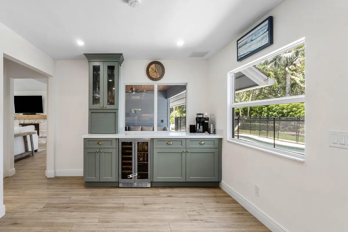 Kitchen/pass thru/wine bar at 18770 SE River Ridge Road, Jupiter