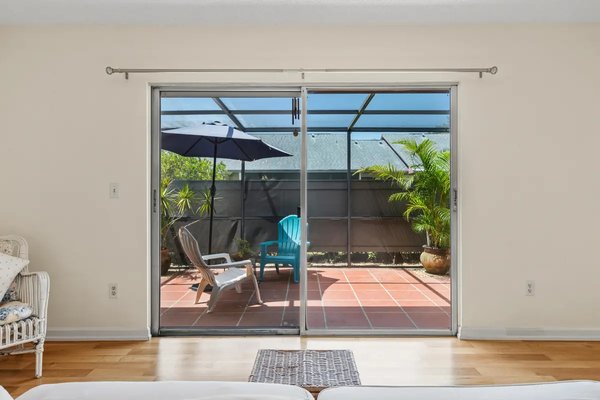 Living Room Sliders open to Lanai at 3981 NW Cinnamon Tree Circle, Jensen Beach