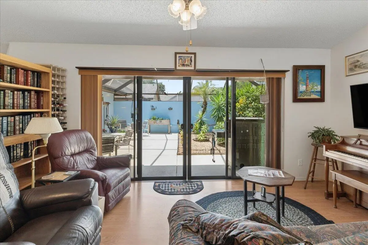 Living Room to Screened Patio at 6287 N Mirror Lake Drive, Sebastian