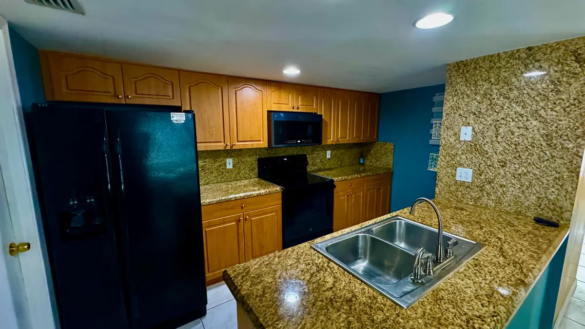 Modern kitchen at 5885 Rambler Rose Way, West Palm Beach