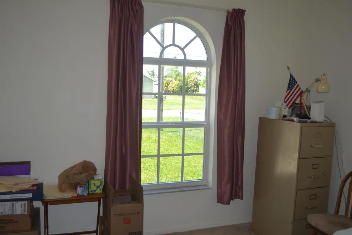 Bedroom with impact window at 6310 Drake Street, Jupiter
