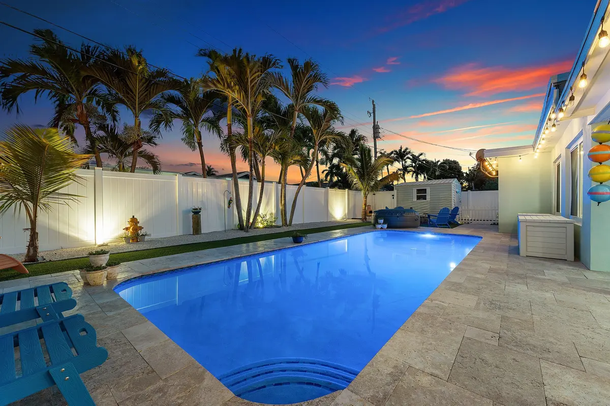 Expansive Travertine Paver Deck at 904 SE 15th Court, Deerfield Beach