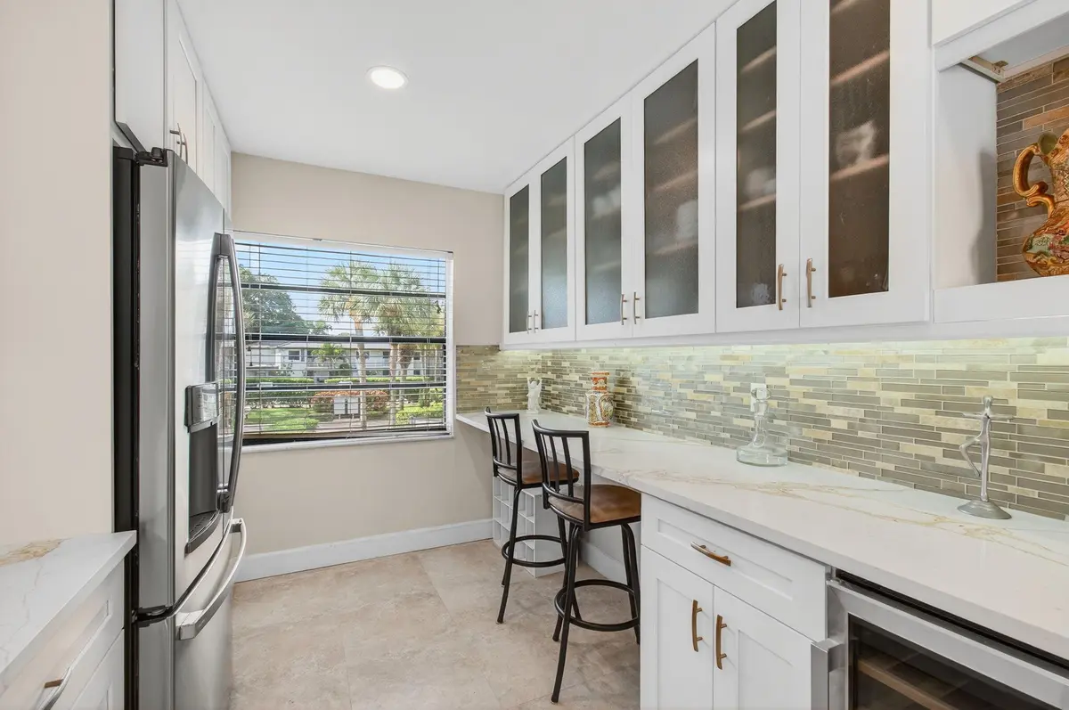 7-Glass Paned Cabinets, Wine Frig at 30 Southport Lane H, Boynton Beach
