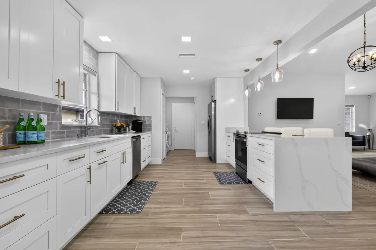 MODERN KITCHEN WITH WATERFALL COUNTER at 10723 GREENTRAIL Drive, Boynton Beach