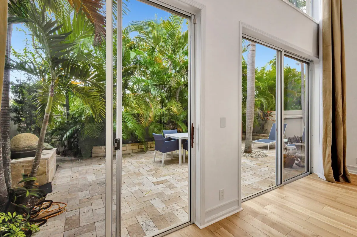 Family room looking out to patio at 2526 NW 52ND Street, Boca Raton