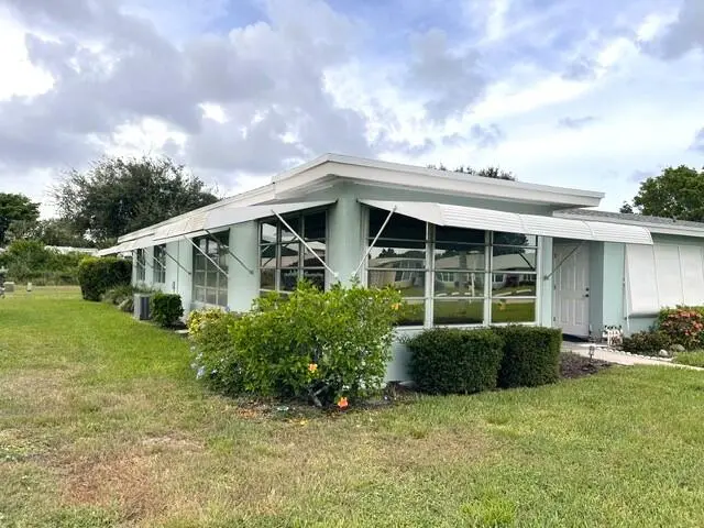 Front and side view of corner villa at 237 HIGH POINT Court A, Delray Beach
