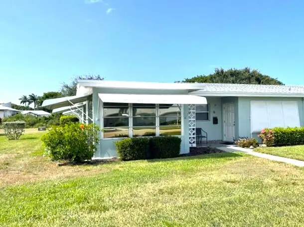 Front view of corner villa 3 at 237 HIGH POINT Court A, Delray Beach