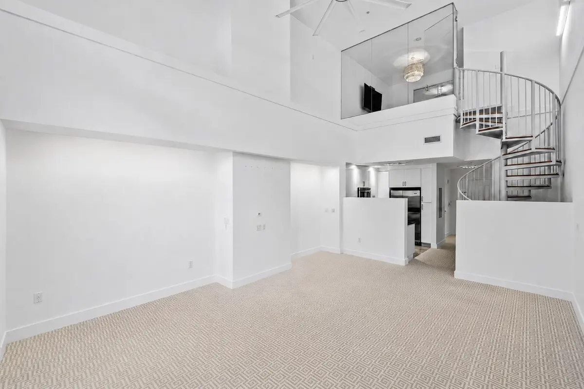 Spiral Staircase to Upstairs Living at 701 S Olive Avenue 119, West Palm Beach