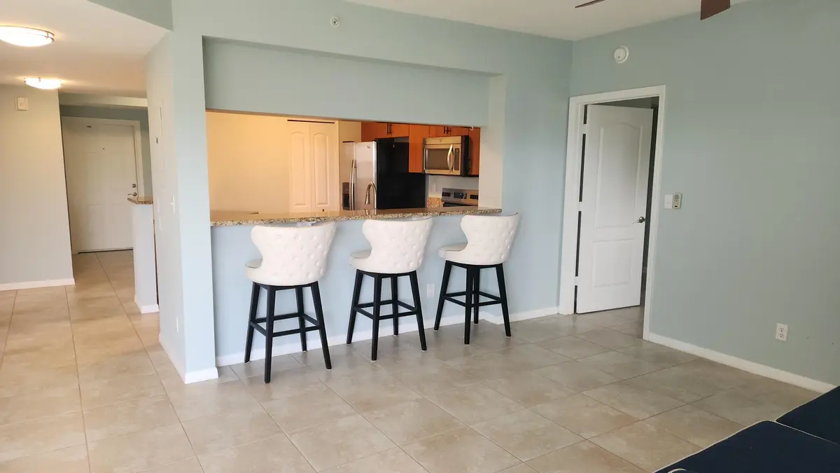 Living room looking to kitchen at 4190 Gator Greens Way 35, Fort Pierce