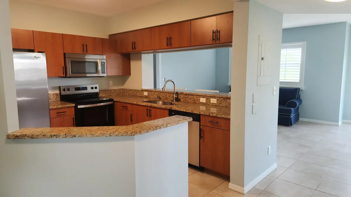 Hallway to kitchen at 4190 Gator Greens Way 35, Fort Pierce