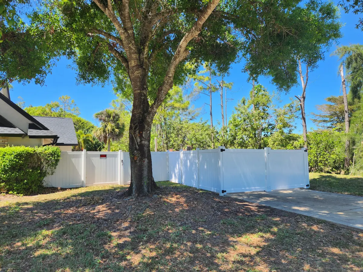 Fenced Side Driveway at 6303 Royal Palm Beach Boulevard, West Palm Beach