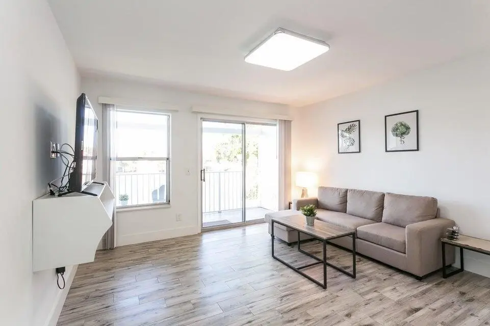 Living Area & Balcony at 275 Cypress Point Drive, Palm Beach Gardens