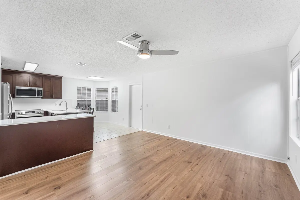 Kitchen and Fam rm at 5601 Berry Blossom Way, West Palm Beach
