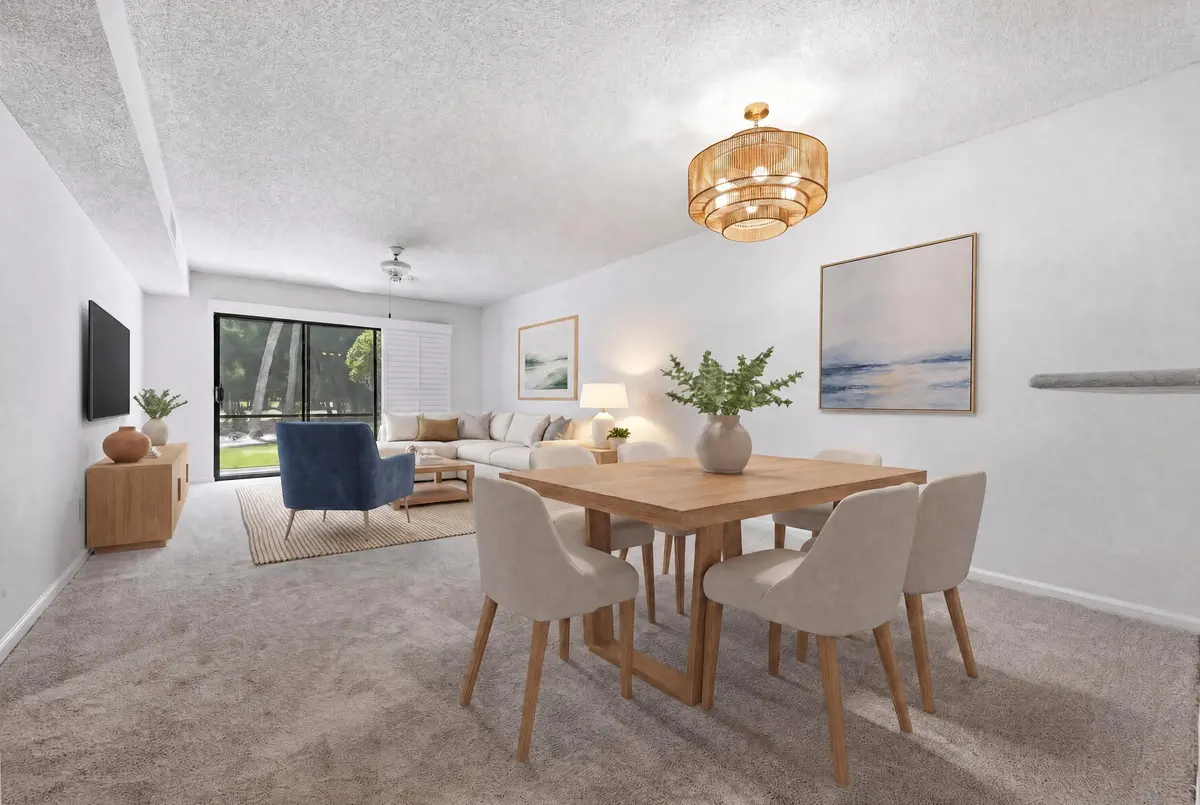 VIRTUAL STAGED DINING AND LIVING at 1141 Keystone Drive C, Jupiter