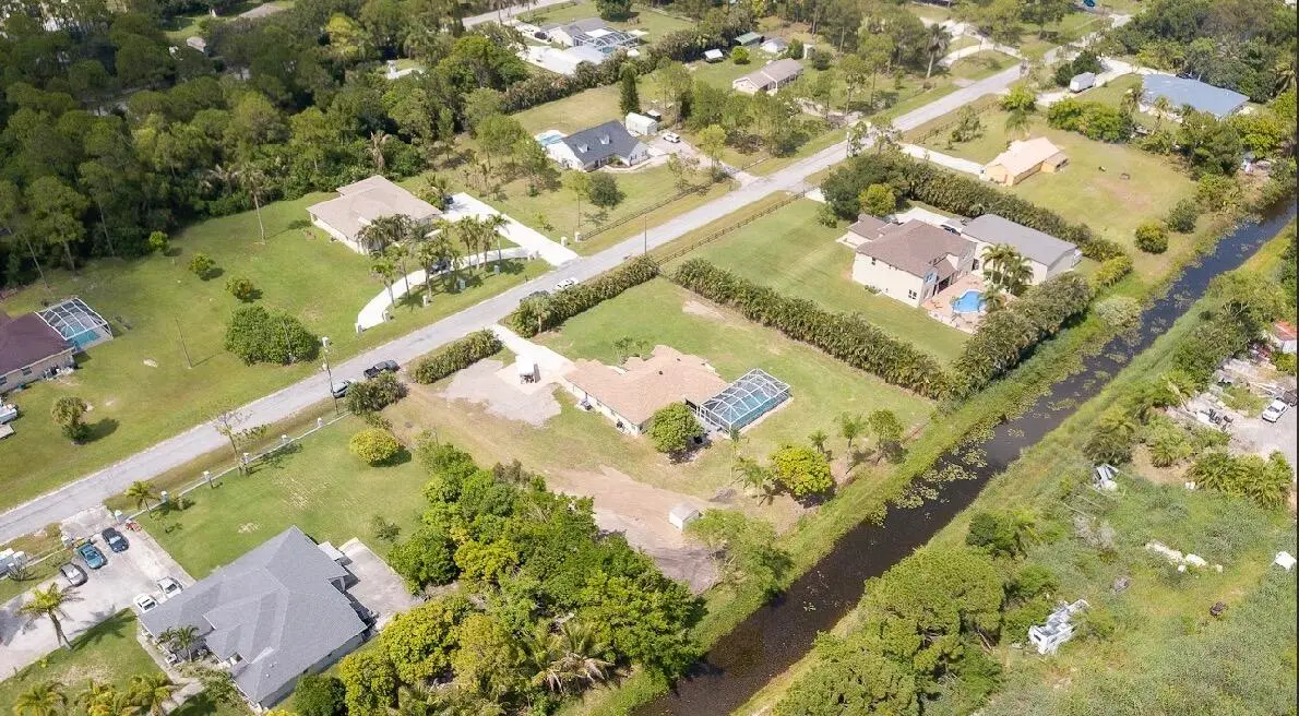 Large yard w/ canal at 14918 92nd Court, West Palm Beach