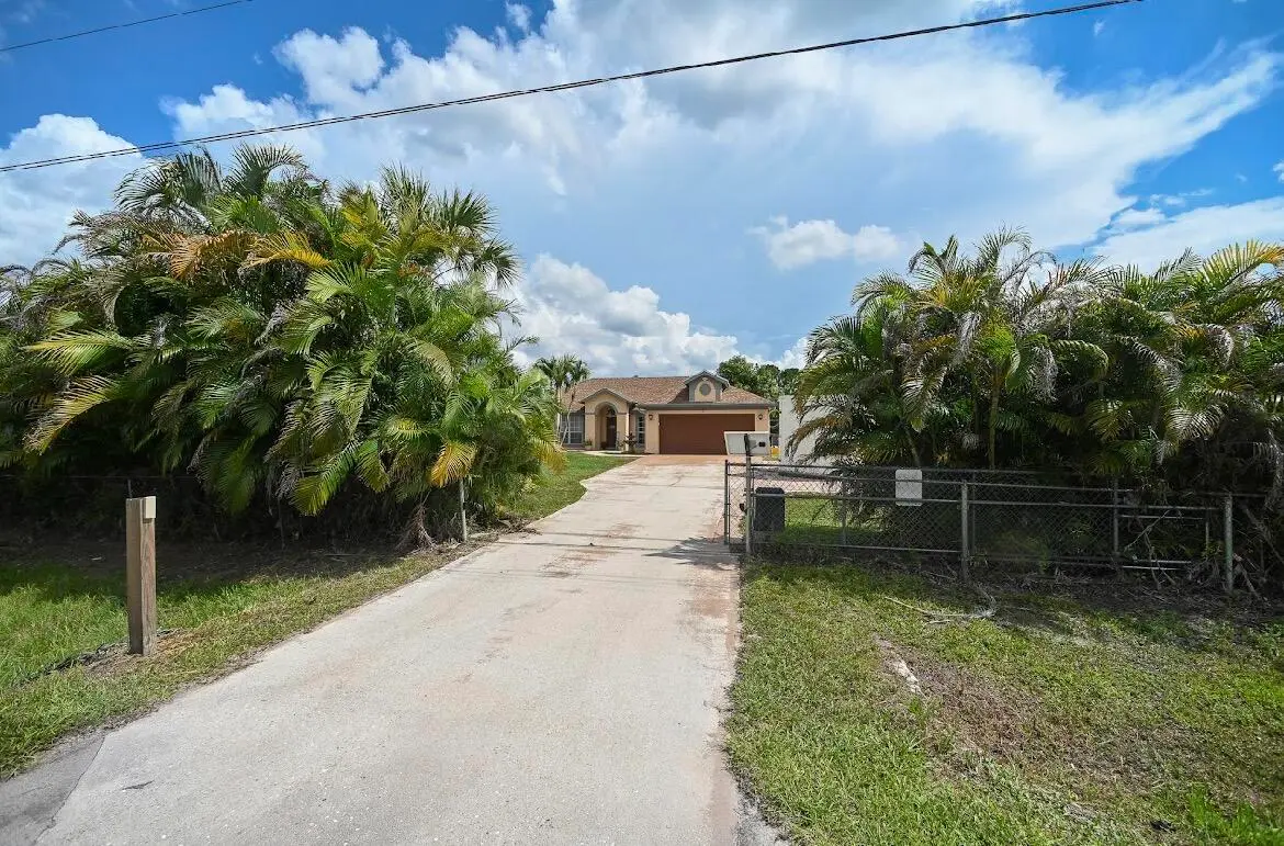 Electric security gate at 14918 92nd Court, West Palm Beach