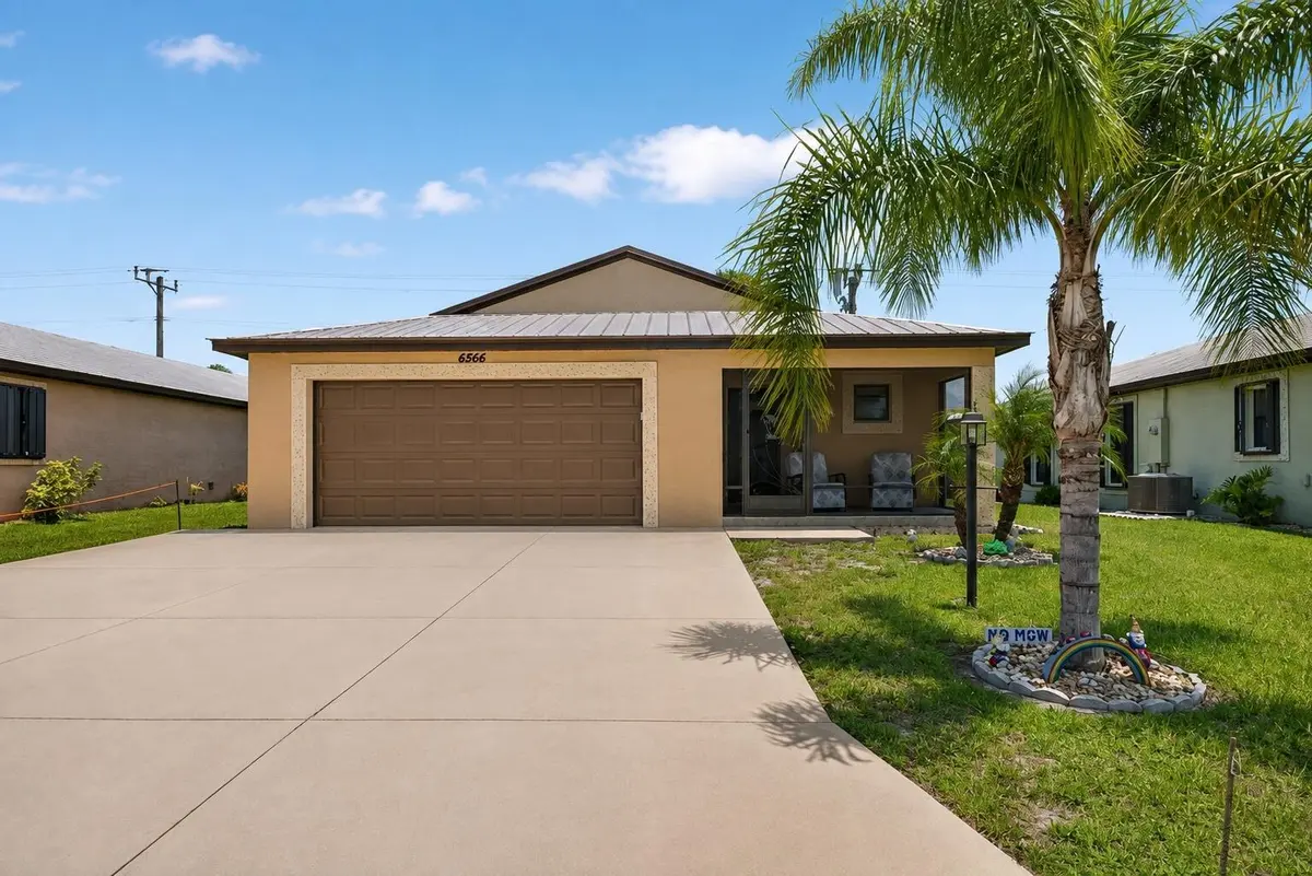 MLS_Exterior_Photo_6566_Garage_Enhanced at 6456 Alemendra Street, Fort Pierce