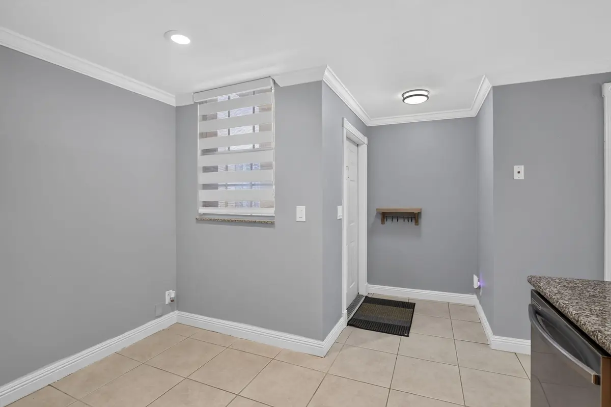 Eat-in Kitchen/Front Door at 1603 Barcelona Way 3-32, Weston