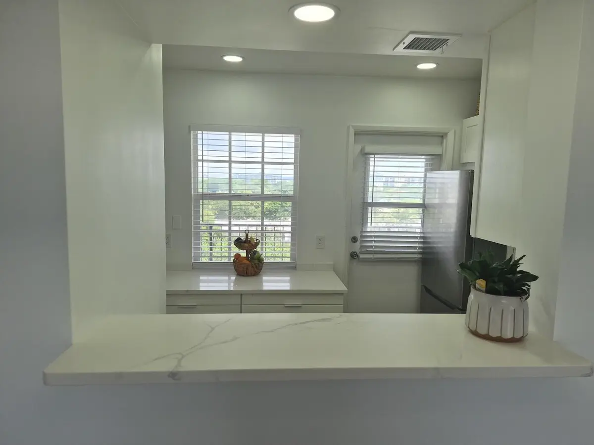 into kitchen at 3050 N PALM AIRE Drive 702, Pompano Beach