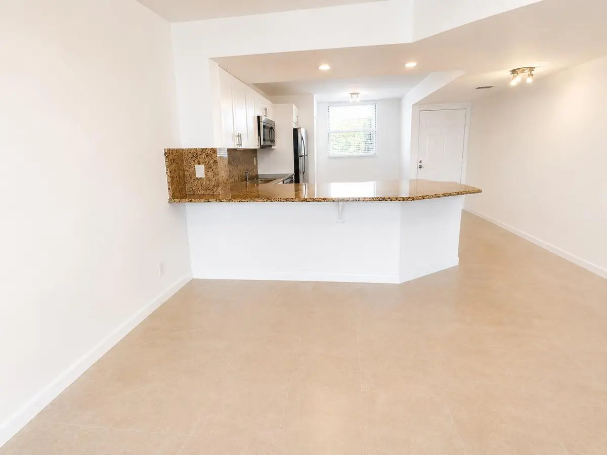 kitchen-pass-through at 115 Lake Emerald Drive 210, Oakland Park