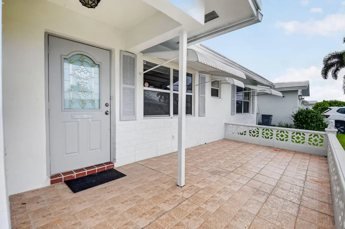 Front Porch/ addtional screened door at 2091 SW 13th Terrace, Boynton Beach