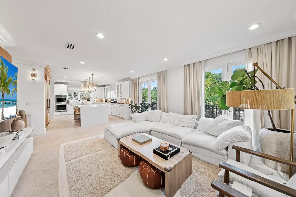 Family Room w/ Media Wall & French Doors at 2765 Brickell Court, Miami