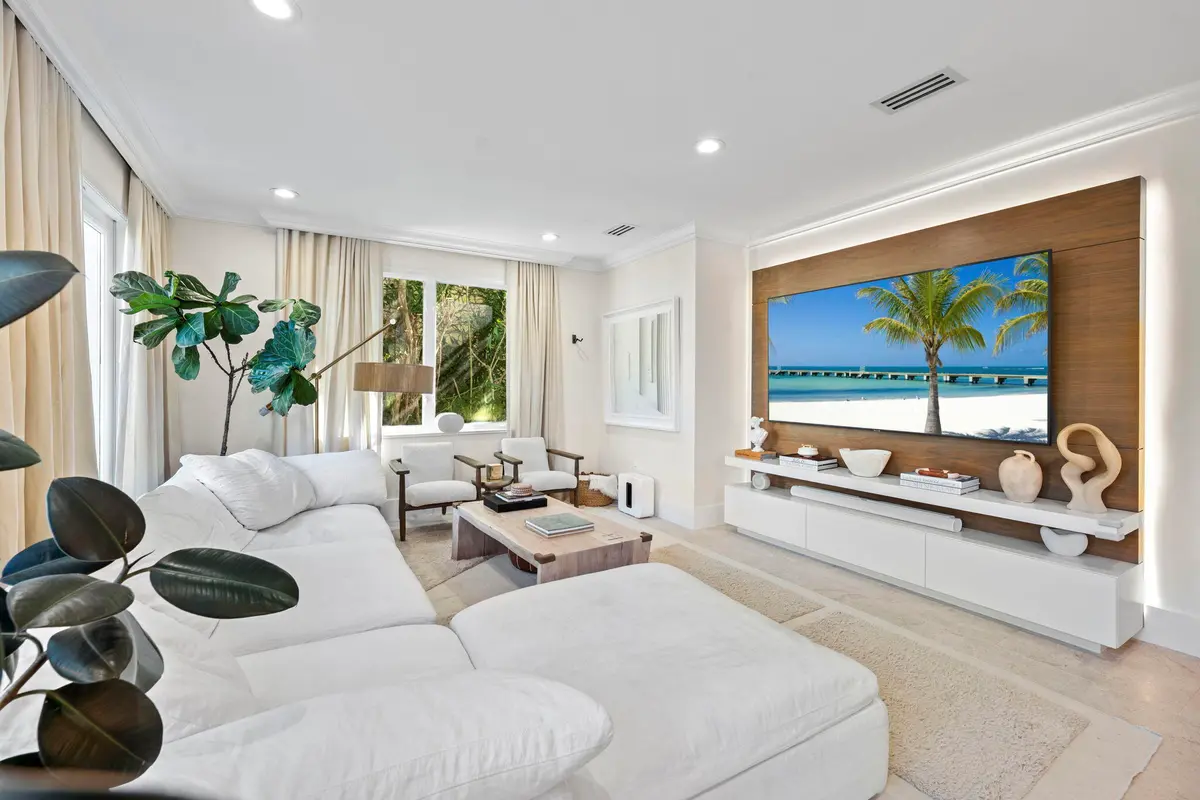 Family Room w/ Media Wall & French Doors at 2765 Brickell Court, Miami