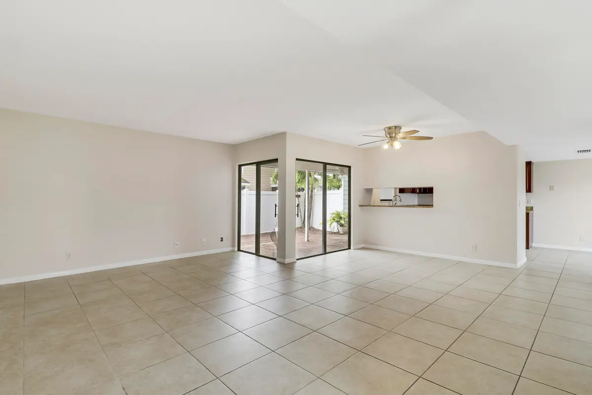 Living area facing kitchen at 202 LAKEWOOD Drive 11B, Jupiter
