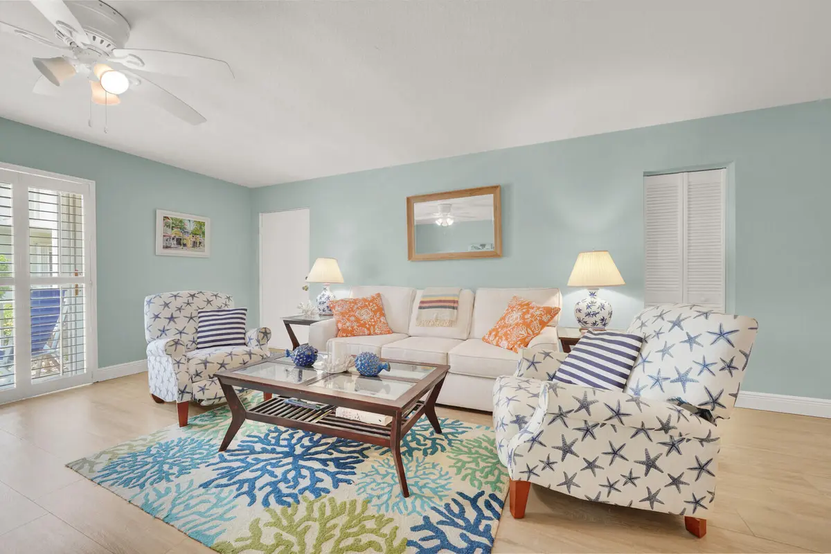 Coastal Living room w/acess to patio at 5500 OLD OCEAN Boulevard 108, Ocean Ridge