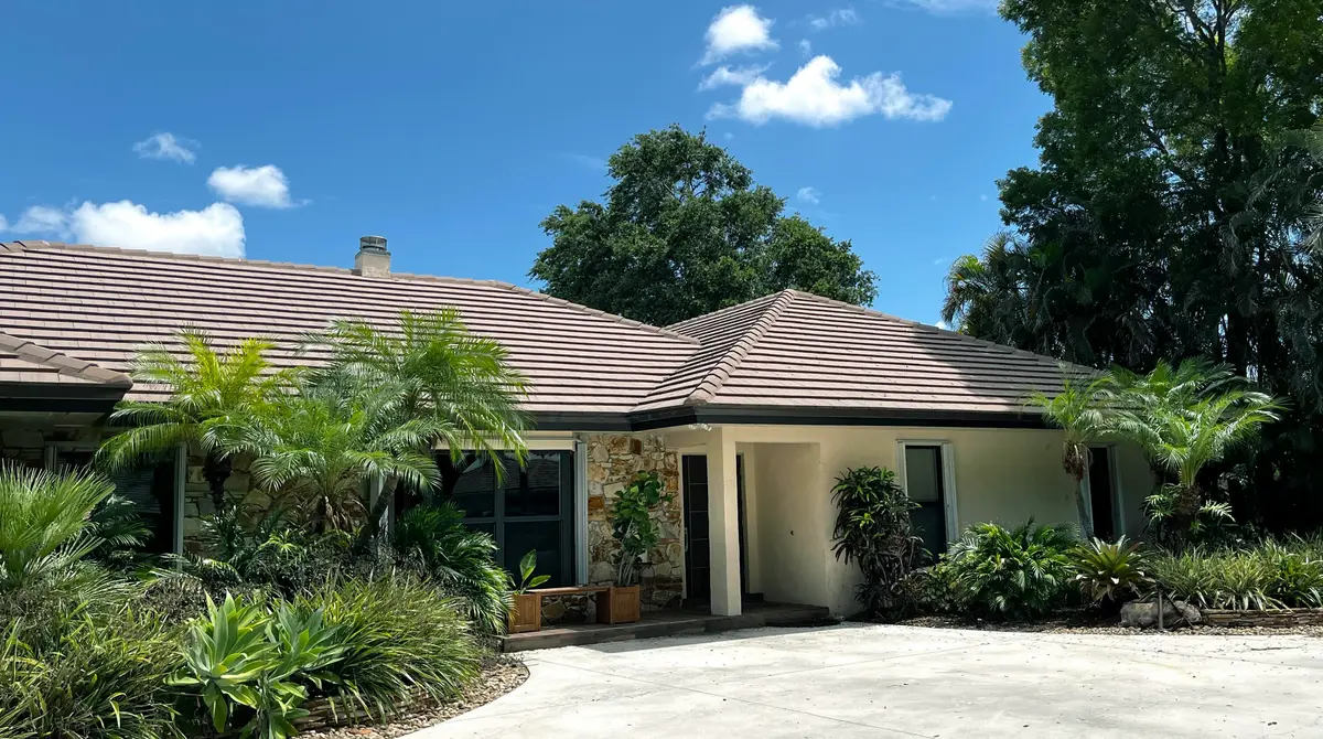 Front Exterior 1 at 5125 WOODLAND LAKES Drive, Palm Beach Gardens