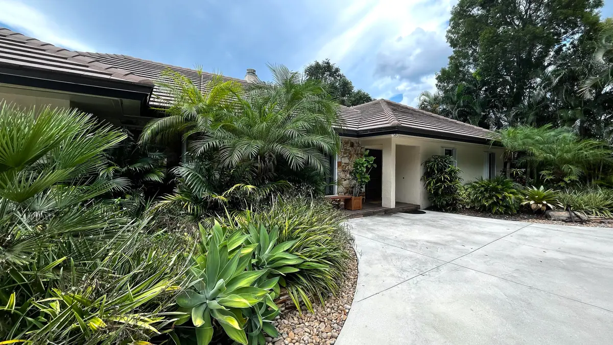Front Exterior 3 at 5125 WOODLAND LAKES Drive, Palm Beach Gardens