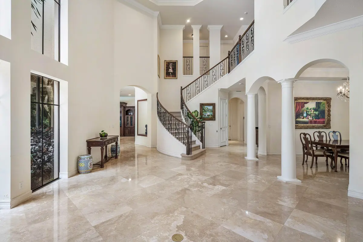 Foyer-and-Curved-Staircase at 17738 Lake Azure Way, Boca Raton