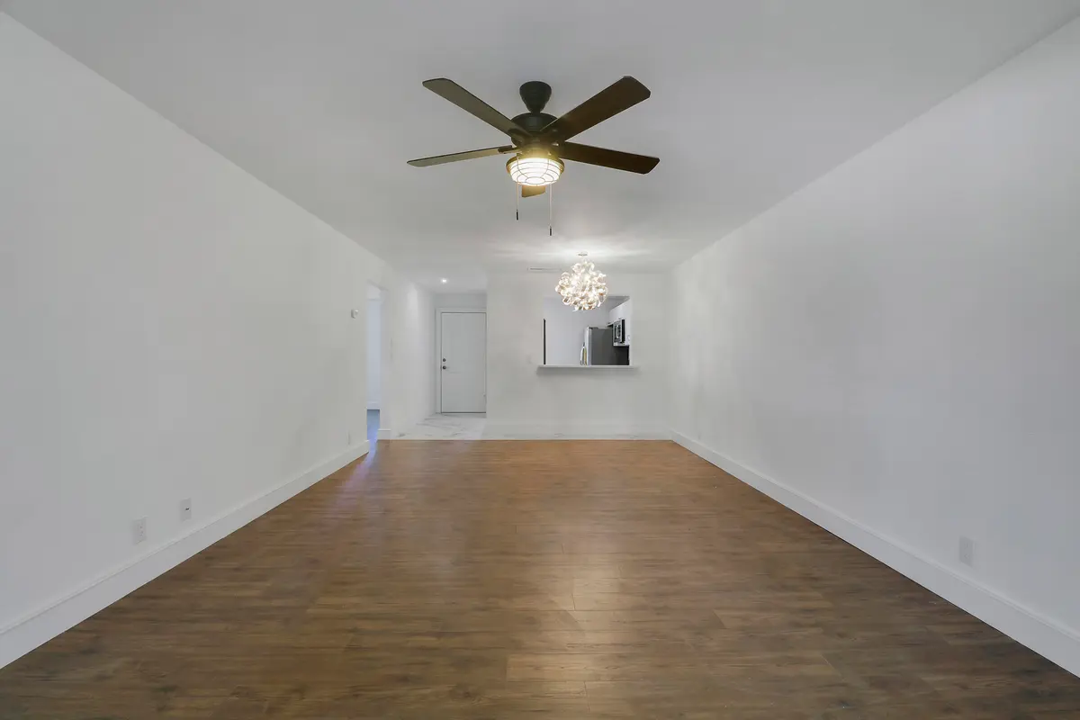 Living Room_Dining Area at 6940 SE Constitution Boulevard 3-203, Hobe Sound