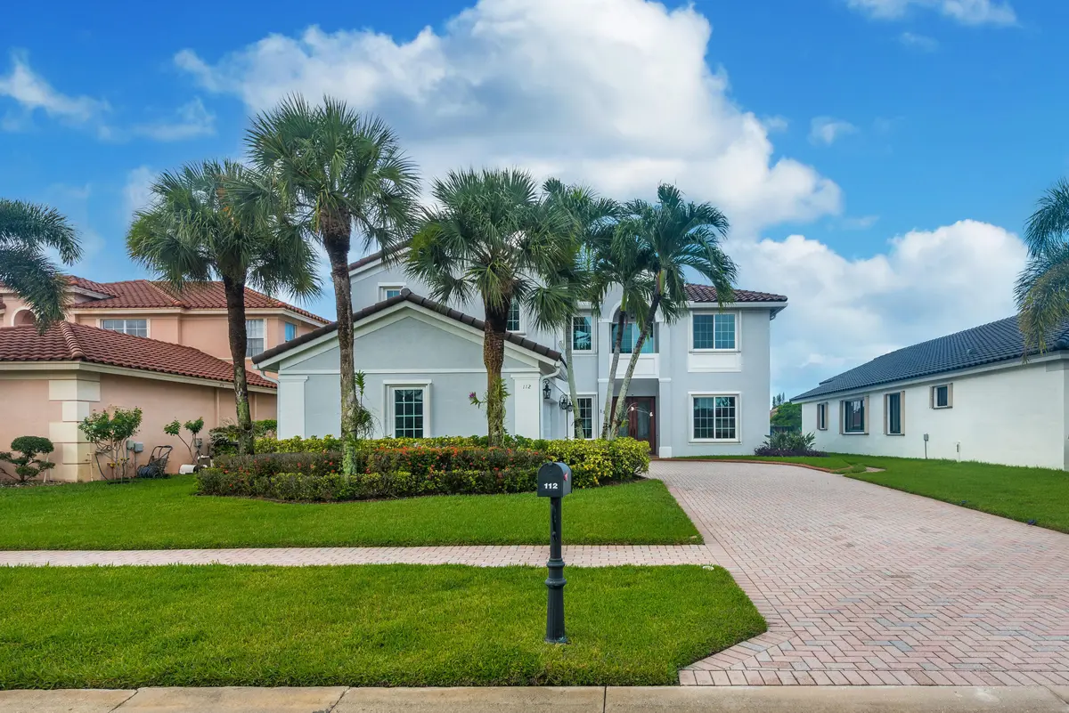 Front Exterior at 112 ISOLA Circle, Royal Palm Beach