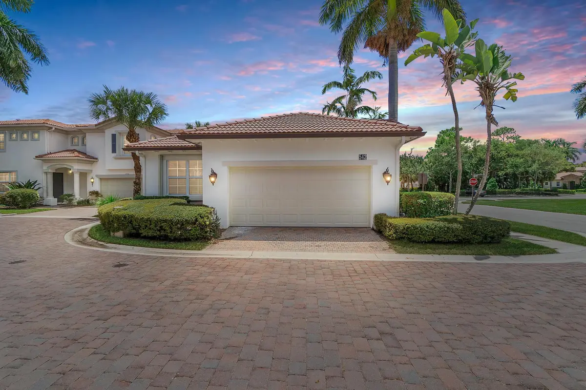 exterior front 542 at sunset at 542 TOMAHAWK Court, Palm Beach Gardens