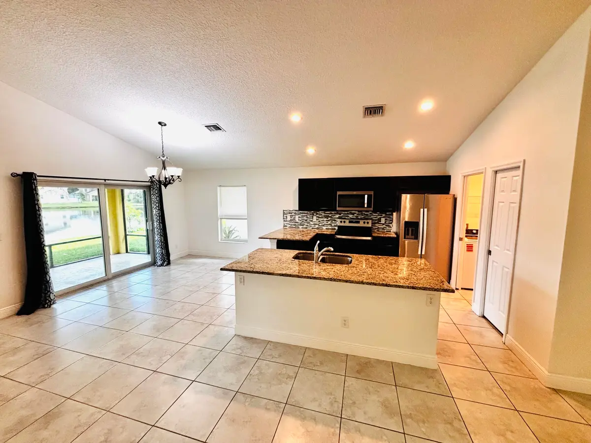 Living Rm and Kitchenand at 9558 SEA SPRAY Drive, Fort Pierce