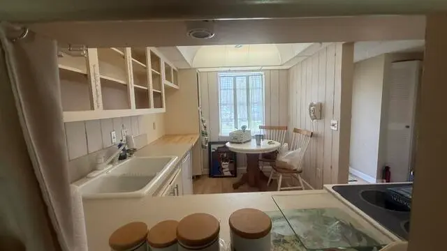 pass thru to kitchen from dininig area at 150 Lake Meryl Drive 145, West Palm Beach